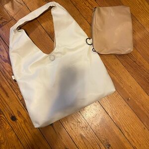 Brand new  ivory,vegan leather boho bag . Comes w/ cosmetic bag.  Never used